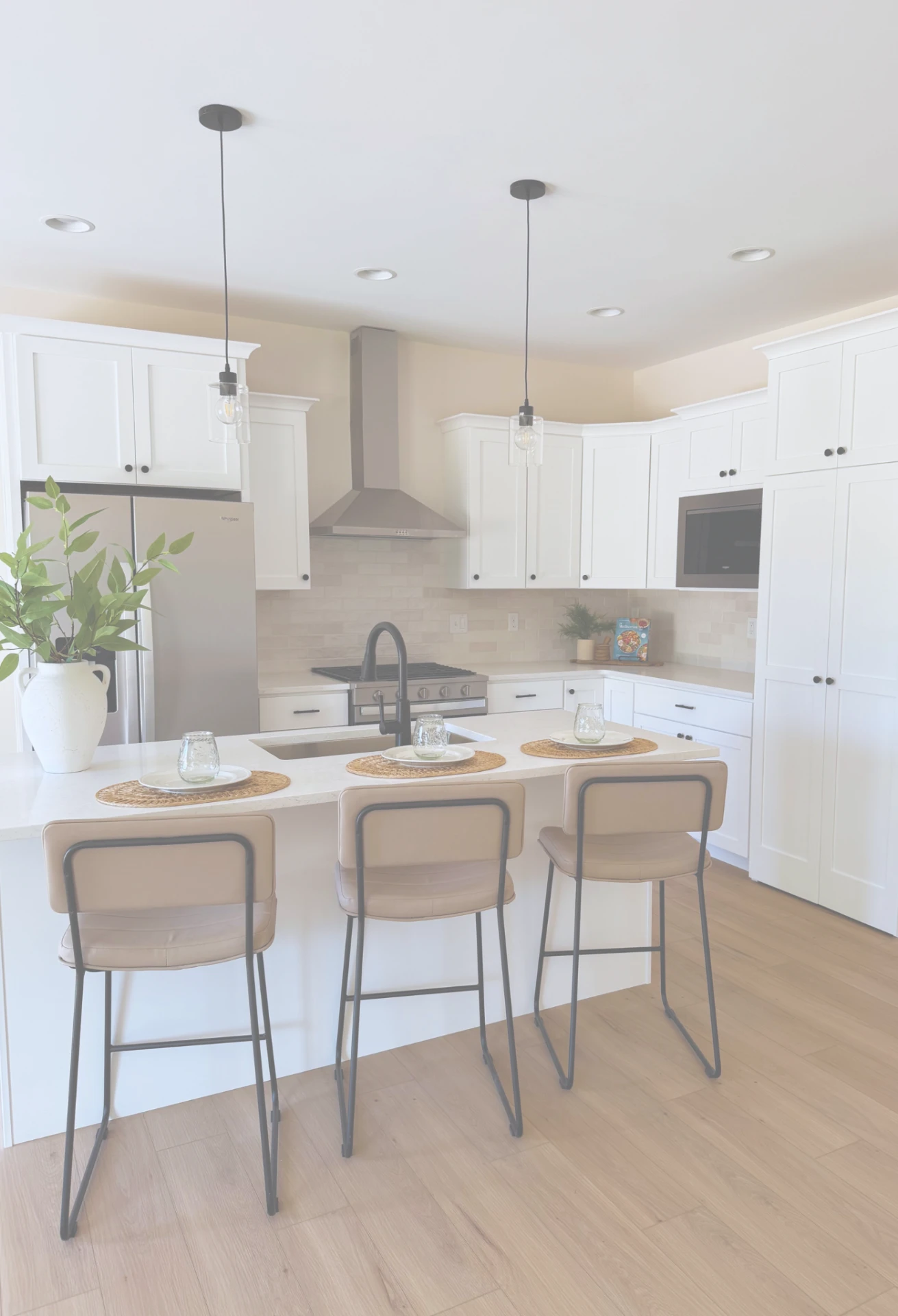 Bright new construction kitchen and living room interior by Sterchi Homes in Evansville, Indiana